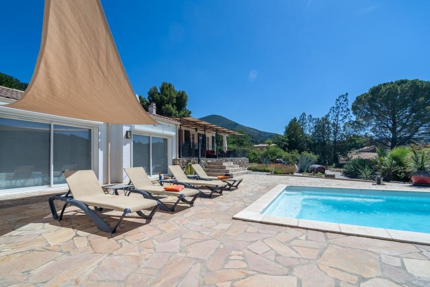 Private swimming pool surrounded by Mediterranean planting